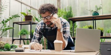 Small business owner using devices